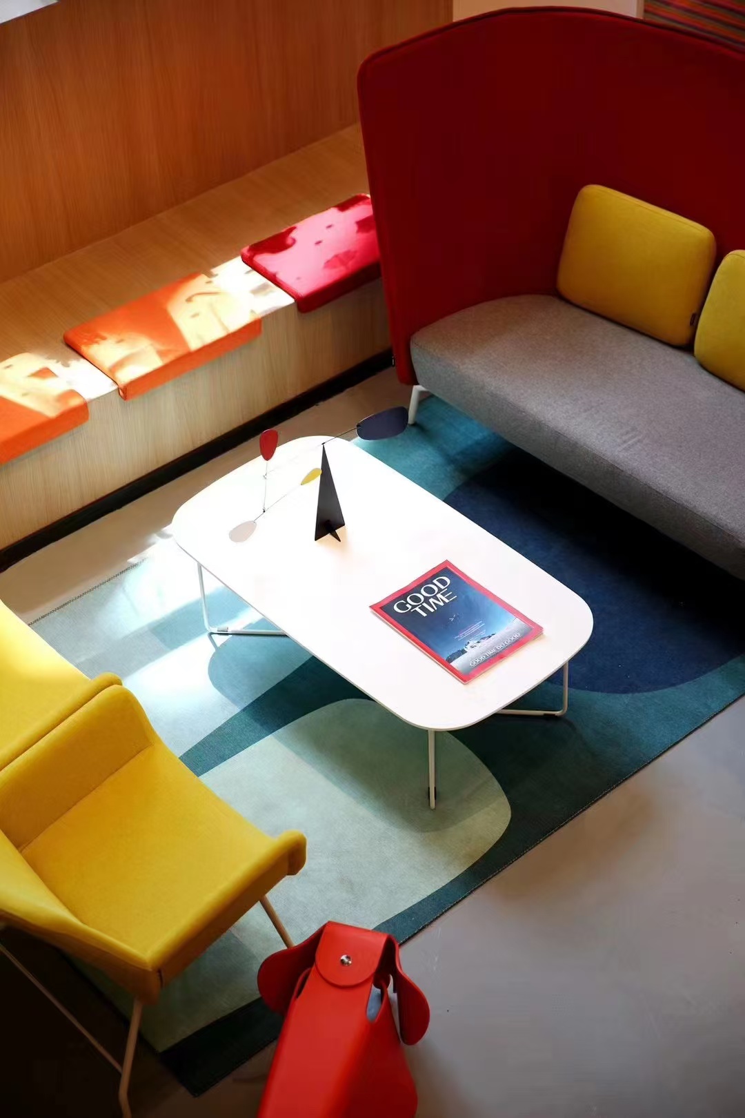 Colourful JCGC office lounge with a GoodTime magazine
